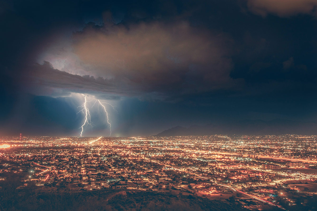 storm over a brightly lit city
