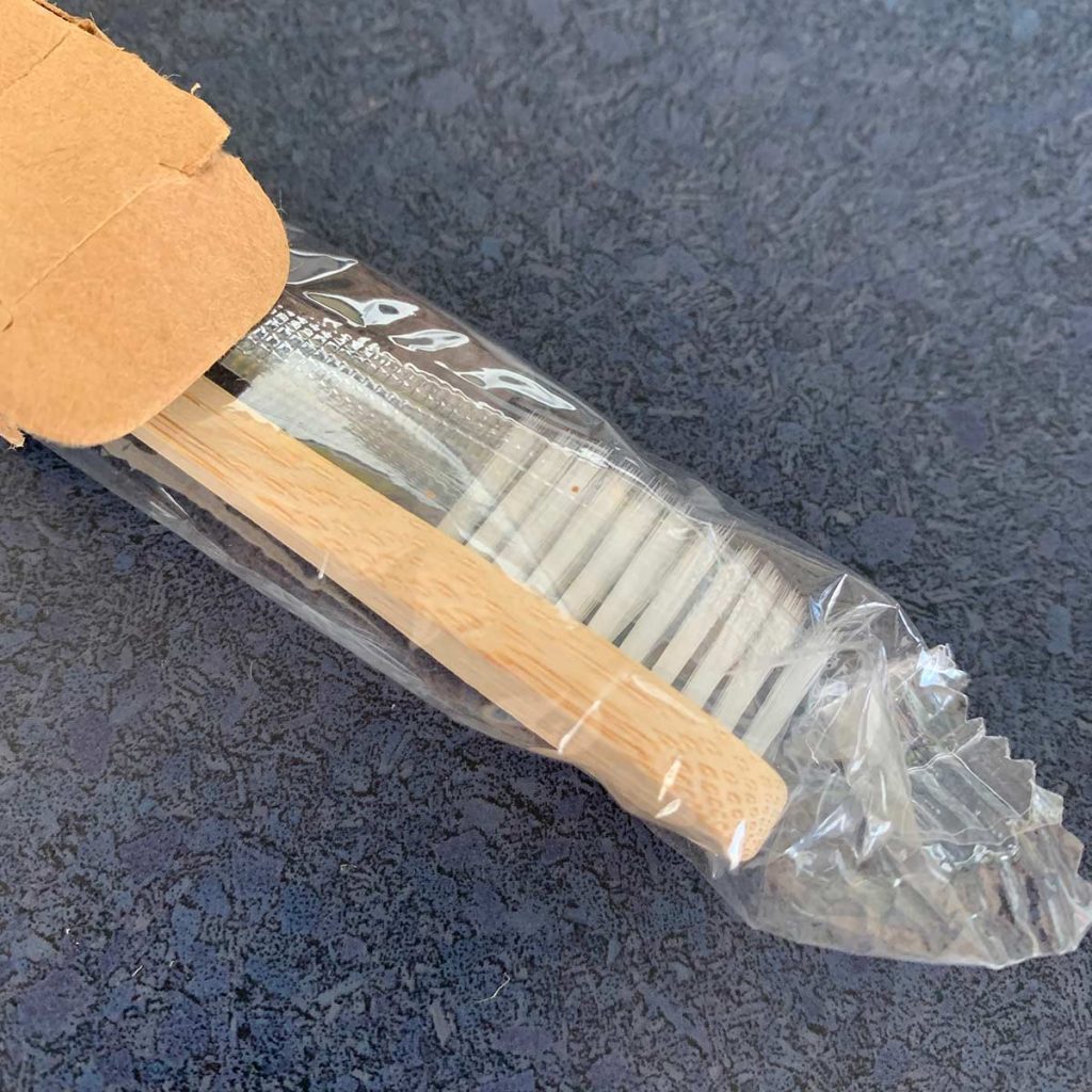 bamboo toothbrush wrapped in plastic